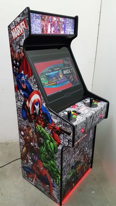 an old arcade machine with the avengers theme on it