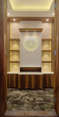 an empty room with wooden shelves and lights on the ceiling is lit by recessed lighting