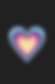 a heart shaped object in the middle of a black background with blue and pink colors