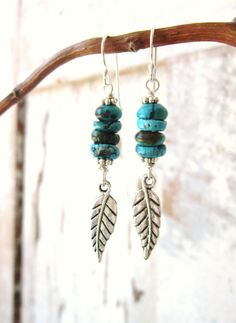 "These genuine turquoise dangle earrings are made up of four natural turquoise rondelle shaped stones stack together. A beautifully detailed silver tierra cast feather dangles from the bottom. The earrings measure 2 1/8\" in length from the top of the sterling silver earwire. All my jewelry comes gift boxed with a bow ready for gift giving, whether it is a gift for you or someone special. Thank you for visiting Jen's Bead Box Jewelry" Genuine Turquoise Jewelry, Turquoise Dangle Earrings, Silver Turquoise Jewelry, Turquoise Earrings Dangle, Earring Ideas, Jewelry Earring, Silver Feather, Genuine Turquoise, Feather Earrings