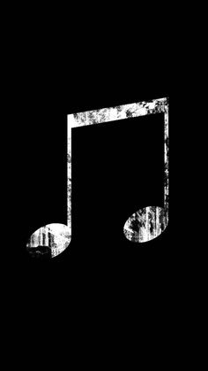 a black and white photo of a musical note