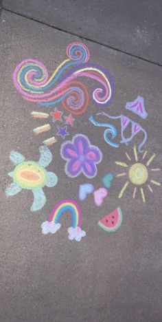 the sidewalk has been drawn with chalk and crayons