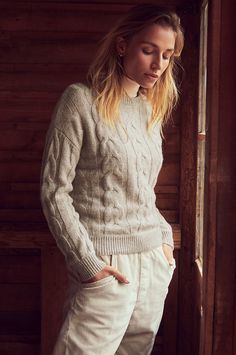 Good luck keeping your head out of the clouds when you put on the 100% cashmere Eden pullover. The lavish, swirling cable design of this beyond-cozy chunky knit complements its divine texture and heathery hues. With a relaxed drop-shoulder design, this dreamy sweater offers a contemporary, slightly cropped length for a feminine, fashion-forward look. Throw it on with practically anything for an oh-so-soft statement that will give a glow to even the grayest of days. Soft Autumn Color Palette, Francoise Hardy, The Eden, Wool Coats, Feminine Fashion, Sheepskin Coat, Winter Outfits Men, Cashmere Turtleneck, Shearling Coat