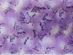 a purple background with many butterflies on it