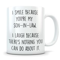 a white coffee mug with the words i smile because you're my sister - in - law