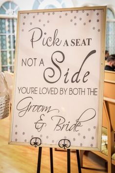 a sign that says pick a seat not a side you're loved by both the groom and bride