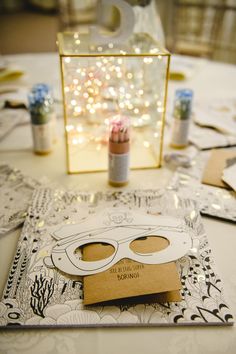 a table topped with lots of cards and paper cut out to look like eyeballs