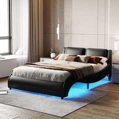 a bed that is sitting in the middle of a room with a blue light underneath it