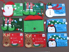 several christmas gift tags with snowmen, penguins and santa hats on them are laid out