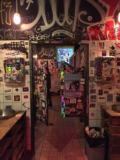 an alleyway with graffiti all over the walls