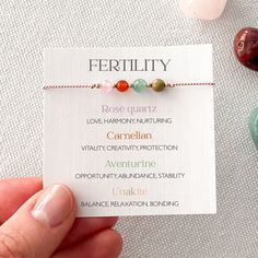 Embrace your journey to motherhood with our Fertility & Pregnancy Crystal Bracelet. This piece is handmade with 4mm beads of Rose Quartz, Aventurine, Unakite, and Carnelian, on a soft, light pink silk cord. Optional Tumble Stone Set: Enhance your experience with an additional set of tumble stones, each unique in size and hue, for extra support and energy. GEMSTONES: ✦ Rose Quartz fosters harmony and emotional healing. ✦ Aventurine promotes stability and vitality. ✦ Unakite encourages emotional b Fertility Gemstone Bracelet, Spiritual Multi-stone Bracelets For Gift, Hand-strung Aventurine Bracelet, Fertility Crystals, Fertility Bracelet, Pregnancy Support, Hand-strung Spiritual Rose Quartz Stretch Bracelet, Adjustable Rose Quartz Bracelets - Spiritual Style, Crystal Set