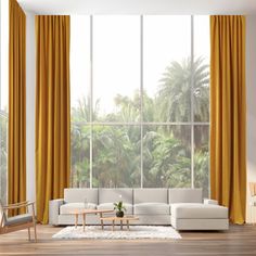 a living room with yellow drapes and white furniture in front of a large window