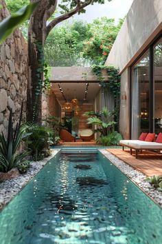 an indoor swimming pool surrounded by greenery