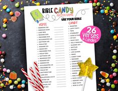 a table with candy, lollipops and candies next to a large printable bible candy chart