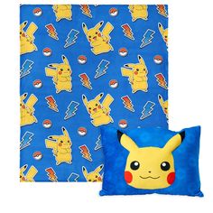 a blue pillow with a pikachu pattern on it next to a pokemon cushion