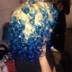 omg i wish my hair was curly enough for this makes me wanna dye my hair blue sigh #whisper #hairgoals #goals #hair Blue And Honey Blonde Hair, Blonde And Blue Curly Hair, Blue Hair On Curly Hair, Blue Hair Curly Natural, Blue Hair Blonde Roots, Dyed Curly Hair Blue, Blue Hair On Tan Skin, Curly Hair Tinsel, Part Dyed Hair