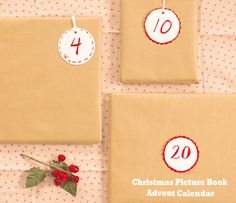 three brown envelopes with christmas pictures on the front and one has a red rose