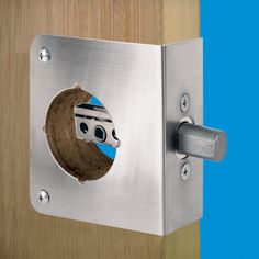 a door handle with a hole in the middle that has an image of a face on it