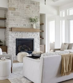 a living room filled with furniture and a fire place