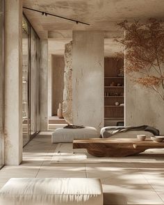 a living room filled with lots of furniture and walls covered in concrete blocks, trees