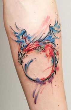 a colorful tattoo on the arm of a woman