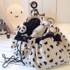 stuffed animals are sitting in a polka dot bag