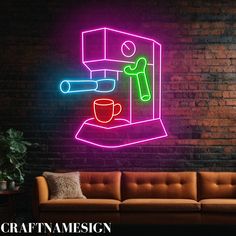 a neon sign that is on the side of a brick wall next to a couch