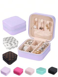 an open jewelry box filled with lots of different colored items in it's compartments