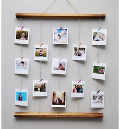 a wooden frame with photos hanging from it's sides and some string attached to the wall