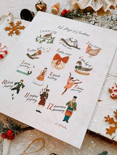 a sheet of paper with christmas stickers on it next to other holiday decorations and ornaments