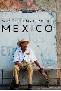 a man sitting on a bench in front of a wall with the words why i left my heart in mexico