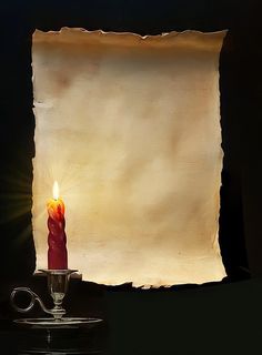 an old paper with a lit candle on it