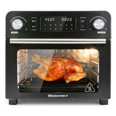 an electric oven with a chicken in it's front door and the timer on