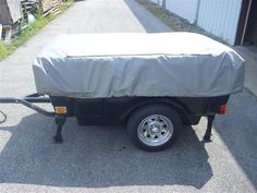 a trailer with a cover on the back of it