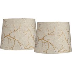 a pair of lamps with branches on them