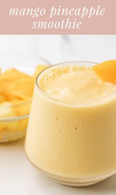 mango pineapple smoothie in a glass next to sliced bananas