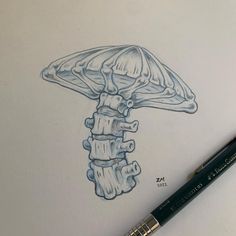 a drawing of a mushroom on paper with a pencil in it's left hand