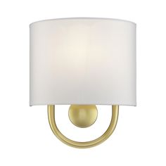 a wall light with a white shade on it