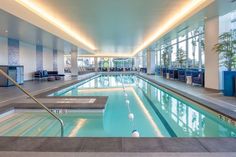 an indoor swimming pool in a large building