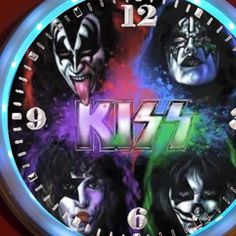 the kiss band with their faces painted in different colors and black, red, green, purple