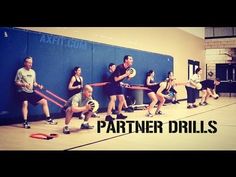 a group of people holding volleyballs in front of a wall with the words partner drills on it