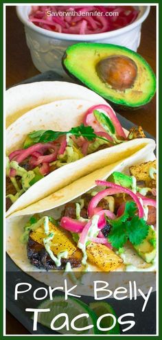 pork belly tacos with avocado, cilantro and red onion on the side