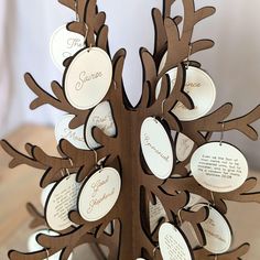 a wooden tree with many different names on it