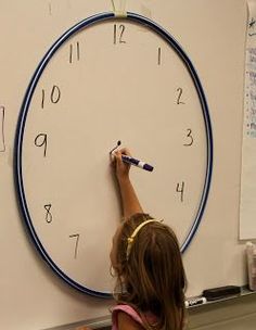 One Extra Degree: Quick Idea for Practicing Telling Time! - with a hoola hoop for a classroom, or on smaller boards, use the border of a paper plate on your smaller board. Teaching Second Grade, Teacher Things, Classroom Fun, Hula Hoop