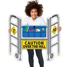 a woman holding a cart with the words caution over the hill on it and an image of a shopping cart behind her