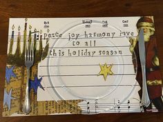 a piece of paper with writing on it next to a fork, knife and spoon