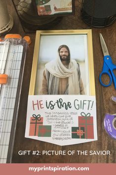 an image of jesus is on the table with scissors and other items