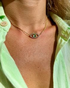 Free shipping for orders over 85$ with code FREESHIPPING85 A fresh and trendy take on Evil Eye Necklace, this beautiful piece features a green-eyed charm set on a vintage-inspired dainty gold chain. The charm detail is encrusted with zirconia crystals in clear and mint green hues. This is a never-take-off necklace that goes well with any of your summer outfits. Rest assured, nothing will highlight your summer tan better than the splash of cool mint and gold. Can be worn as a short choker if you Green Evil Eye Necklace, Spiritual Green Jewelry With Evil Eye, Gold Green Necklace, Summer Necklace Beach, Blue Evil Eye Metal Necklace, Turquoise Evil Eye Amulet Necklace, Gold-plated Evil Eye Amulet Necklace, Summer Tan, Necklace Evil Eye