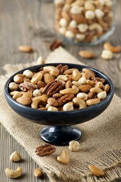 nuts are in a bowl on a table