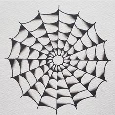 a black and white drawing of a spider web